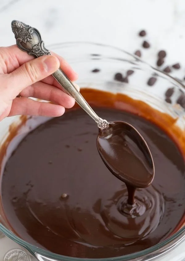 Creamy chocolate ganache drizzled over a rich cake