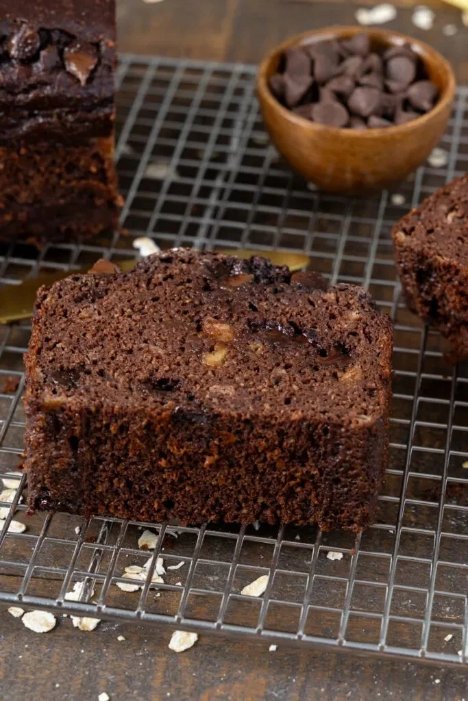 Slices of chocolate protein banana bread topped with chocolate chips