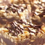 Delicious No Bake Chocolate Oatmeal Bars with chocolate and peanut butter layers.