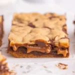 Delicious Knock You Naked Bars with layers of caramel and chocolate brownies.