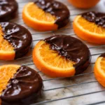 Classic homemade orange candy slices on a plate, ready to enjoy.