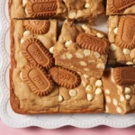 Decadent Biscoff Blondies with cookie butter, crunchy Biscoff cookies, and white chocolate.