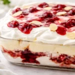 Heaven On Earth Cake layered with angel food cake, cherry pie filling, and creamy pudding.