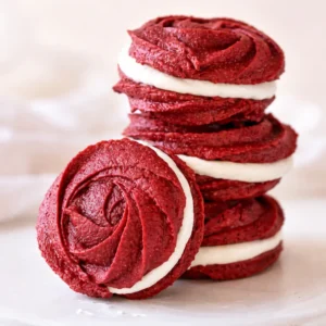 Delicious Red Velvet Rose Sandwich Cookies with creamy filling, ideal for Valentine's Day.