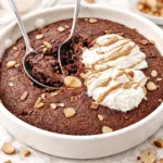 Delicious high protein brownie skillet warm and served with a scoop of ice cream.