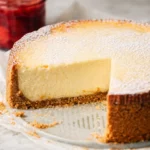 Delicious slice of rich and creamy New York Cheesecake topped with fresh strawberries.