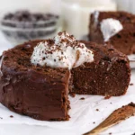 Delicious high-protein cake topped with frosting, made from Greek yogurt and protein powder.