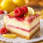 Delicious Raspberry Swirl Cheesecake with red raspberry swirls on a graham cracker crust.