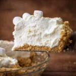 Creamy Marshmallow Whip Cheesecake topped with fluffy marshmallow whipped cream