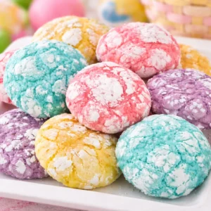 Springtime Crinkle Cookies dusted with powdered sugar, showcasing pastel colors and lemon flavor.