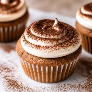 Chocolate Tiramisu Cupcakes with mascarpone frosting and cocoa powder