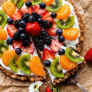 Colorful array of healthy desserts with fruit including tarts and mousses.