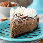 Delicious no-bake German Chocolate Cheesecake with Oreo crust and coconut pecan topping.