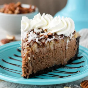 Delicious no-bake German Chocolate Cheesecake with Oreo crust and coconut pecan topping.