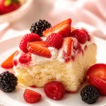 Lemon Berry Mascarpone Cake with fresh berries and creamy frosting on a rustic table.